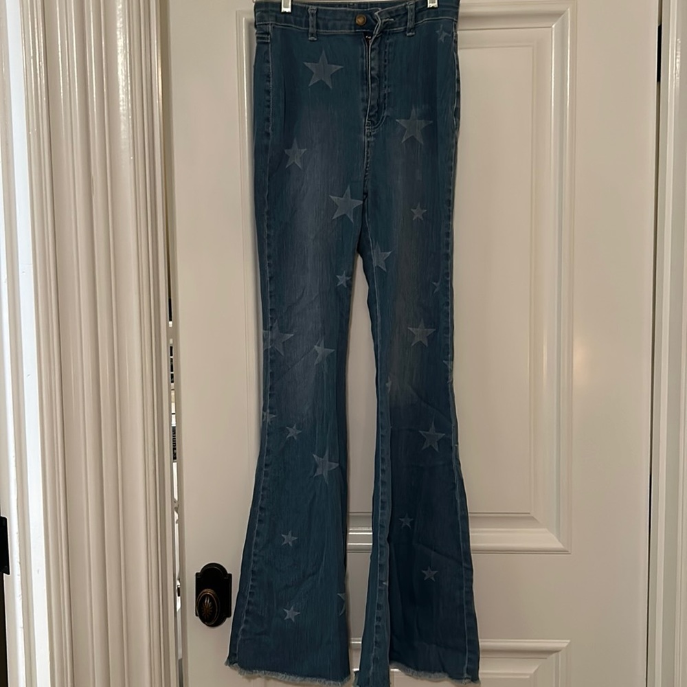 Nasty Gal Flare star jeans, size 6. Fringe bottoms, like new!